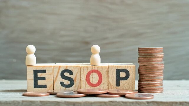 Employee stock option (ESOP) concept with wooden blocks, a figure, and coins.