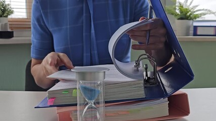 Organizing important documents with a time management tool in a bright workspace