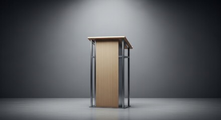 A wooden podium with a metal frame, standing in a dimly lit room with a gray background.