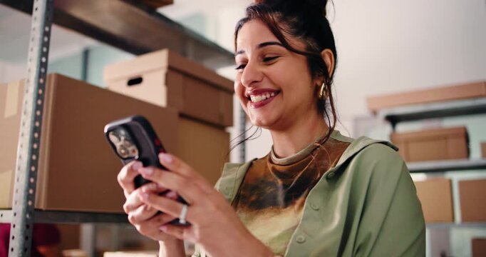 Phone, fist pump and woman in office for supply chain, shipping and sale success for boutique. Small business, ecommerce and person celebrate on smartphone for good news, distribution and logistics