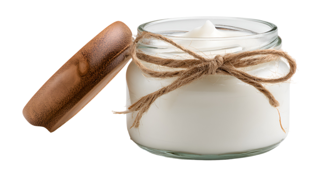 Glass jar with white cream and wooden lid isolated on transparent background