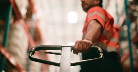 Trolley, handle and hand of worker in warehouse for cargo, supply chain or freight delivery. Distribution, pallet jack and male logistics employee with quality assurance for shipping with low angle. - Powered by Adobe