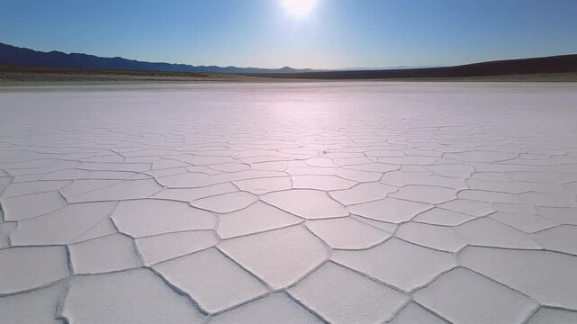Cinematic Aerial Dolly-In Over Cracked Desert Salt Flats