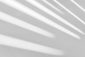 Gray shadow and light blur abstract background on white wall  from window. Dark stripe grey shadows...