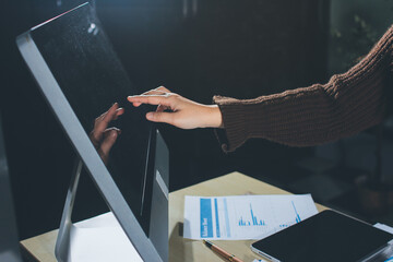 Close-up of businessman's hands making notes, mobiles, chart, desk, office