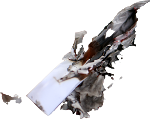 A partially burned piece of paper with scorched edges and black ash on a transparent background