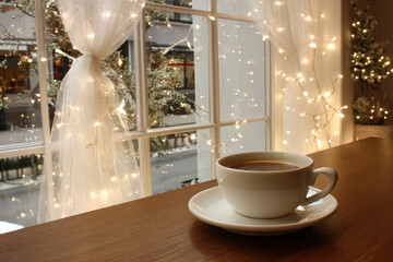 cozy american coffee shop adorned with twinkling christmas lights creates warm atmosphere