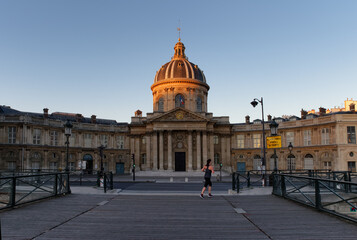 Running on the Conti quay front of the Institute of France in Paris city