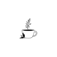 A man reading a book next to a cup with a plant