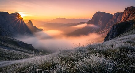 Majestic mountain valley sunrise with fog and clouds