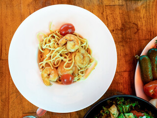 top view of spaghetti pasta with fried king prawns