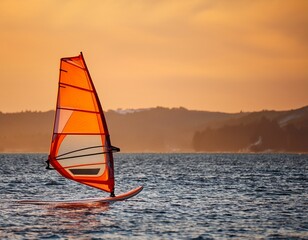 orange windsurfing sailboard ready for action