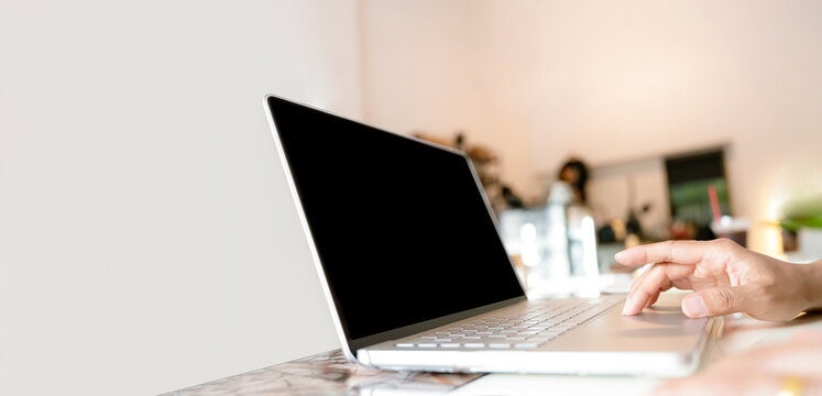 Hands typing on laptop keyboard in modern workspace.Person finger on computer idear for Technology,freelance,business,remote work concept or digital marketing,productivity,office,work from home visua