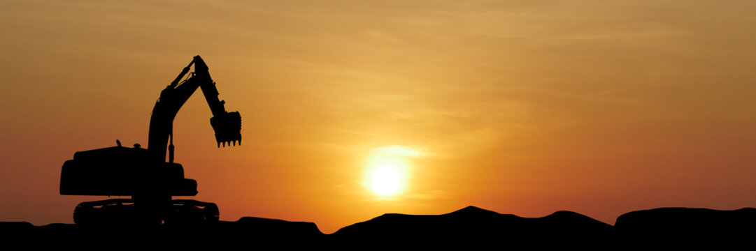 Silhouette of an Excavator at Sunset: An excavator stands silhouetted against a fiery sunset, a powerful image that evokes themes of industry, labor, and the relentless march of progress. 