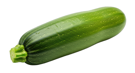 A single fresh green zucchini with pale yellow speckles and a textured stem sits isolated on a plain black background with studio lighting highlighting its smooth skin and cylindrical shape
