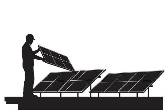 Silhouette of worker installing solar panels