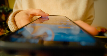 Woman scrolling and interacting with smartphone screen, browsing online content in time lapse