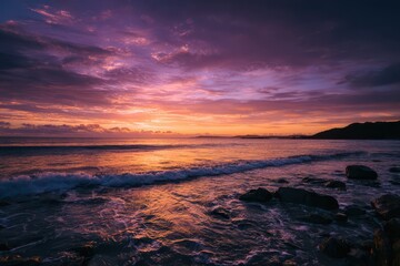 Obraz premium Dawn Seascape: Soft Clouds, Calm Waters, Vibrant Sunrise