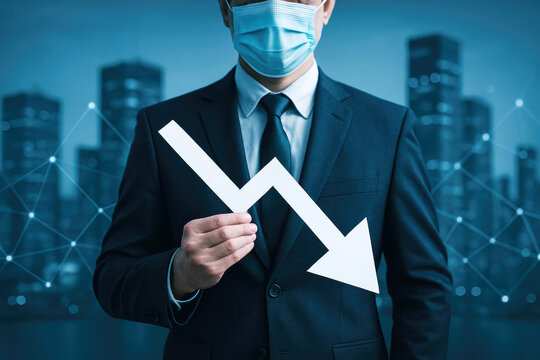 Businessman in suit and face mask holding a white downward trending arrow with digital network overlay