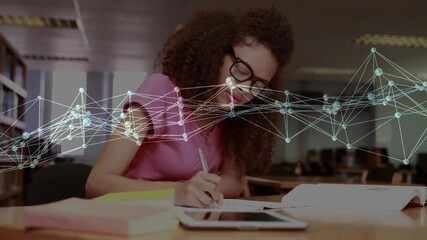 Woman student tapping tablet using book, writing study notes while faint network drifting over desk - Powered by Adobe