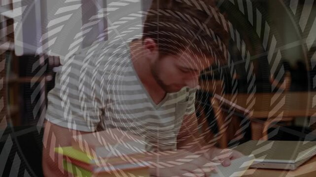Man lifting head, pushing up, opening book at library table, spiral overlay guiding study focus