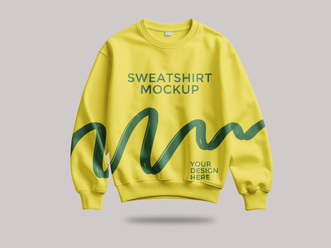 Yellow sweatshirt mockup with green graphic and text placeholder