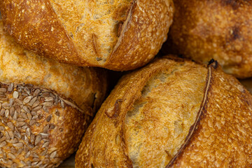 Fresh bread from the oven at a small artisan bakery at home. Very healthy sourdough bread products of various types. 