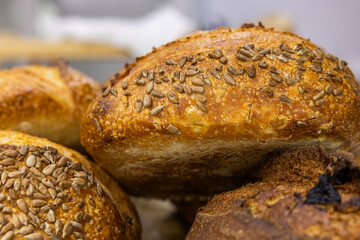 Fresh bread from the oven at a small artisan bakery at home. Very healthy sourdough bread products of various types. 
