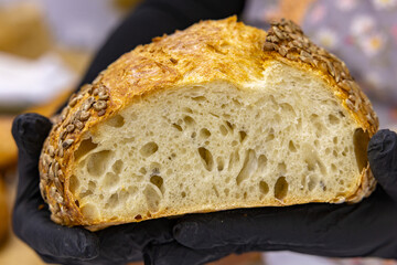 Fresh bread from the oven at a small artisan bakery at home. Very healthy sourdough bread products of various types. 
