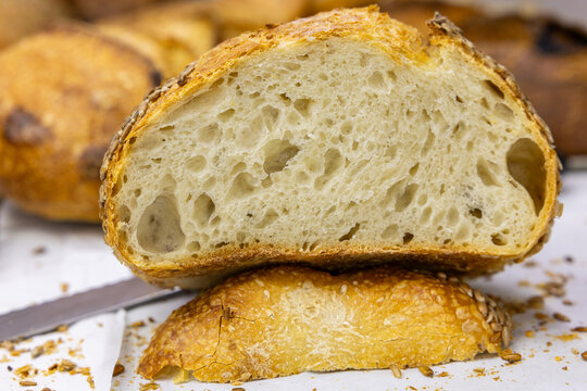 Fresh bread from the oven at a small artisan bakery at home. Very healthy sourdough bread products of various types.