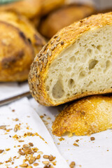 Fresh bread from the oven at a small artisan bakery at home. Very healthy sourdough bread products of various types. 