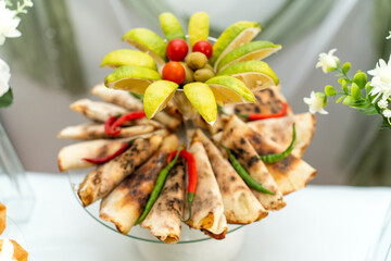 Deliciously arranged traditional snacks with fresh fruits at a festive gathering