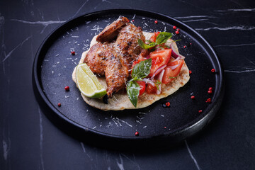 Roasted Chicken on Flatbread With Tomato Salad, Lime Wedge