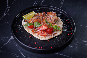 Roasted Chicken on Flatbread With Tomato Salad, Lime Wedge