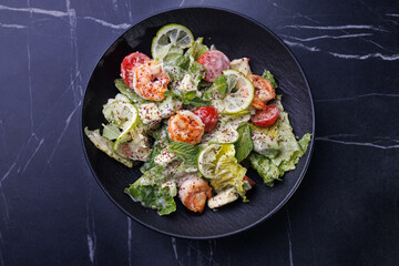 Gourmet Shrimp And Citrus Salad On Black Plate
