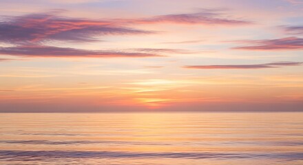 Fototapeta premium Colorful Sunset Sky Over Calm Ocean with Pink and Orange Clouds