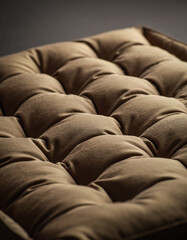 Fototapeta premium A close-up, detailed shot of a tufted, brown upholstered surface, emphasizing texture and depth.