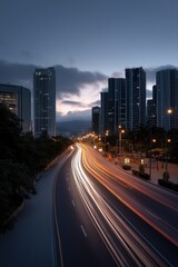 Obraz premium Evening cityscape with light trails on urban road and skyscrapers at dusk