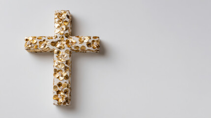 wooden christmas cross adorned with golden decorations is displayed against clean white background