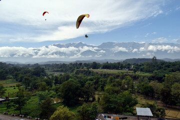 Paragliding over the clouds at Bir Billing Himachal Pradesh India. Clouds in the sky, Dhauladhar...
