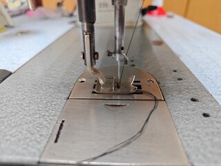 Sewing machine, working with threads, working with a needle, sewing equipment, close-up.