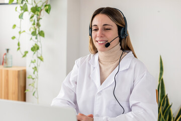 Doctor smiling during virtual consultation at home. Confident healthcare worker assisting patient online. Medical technology and wellbeing concept.