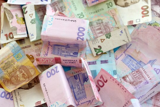 Big amount of different Ukrainian hryvnia money bills. Pile of crumpled ukrainian banknotes - Powered by Adobe