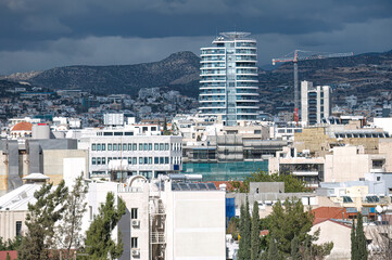 Modern architecture towering over traditional buildings in Limassol cityscape, Cyprus