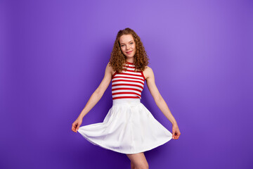 Naklejka premium Casual summer fashion model with red hair striped top and white skirt against purple background