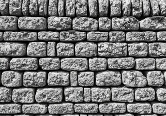 Obraz premium A detailed closeup of a grey stone wall texture with a repeating pattern