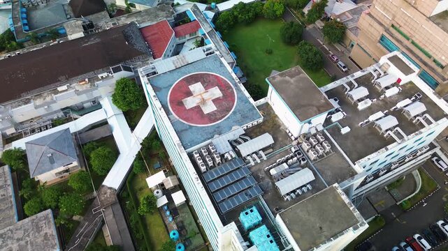 Aerial View of Hospital Building with Helipad in Daytime