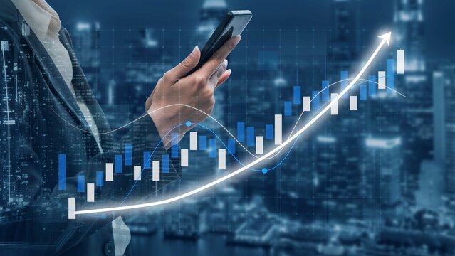 A business professional interacts with a smartphone, set against a night city skyline and a dynamic stock market graph illustrating financial growth and trends. Copula