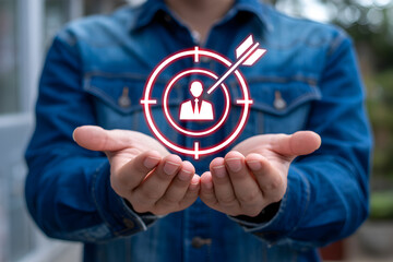 Person holding a target icon with an arrow hitting the center, focusing on a customer.