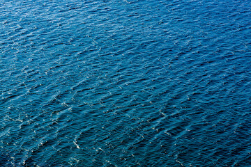 Dark blue wavy sea background photo. Dark blue wavy sea wallpaper.